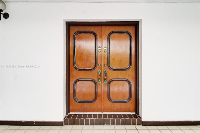 exterior details featuring tile patterned floors