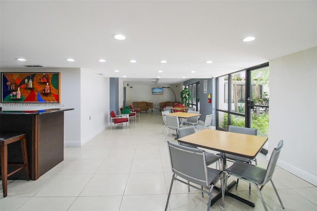 dining area with light tile patterned flooring