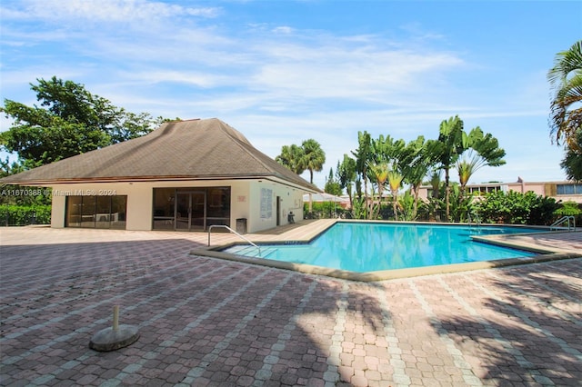 view of swimming pool with a patio area