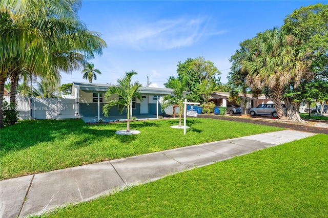 single story home with a front yard