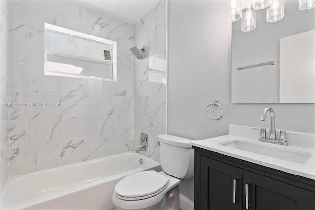 full bathroom featuring vanity, tiled shower / bath, and toilet