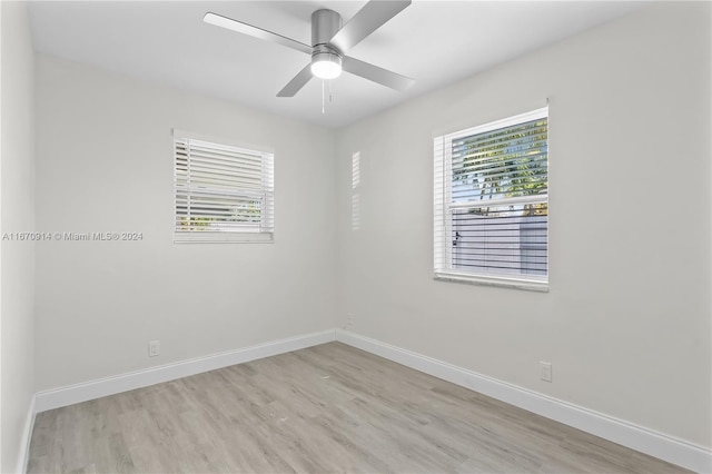 empty room featuring light hardwood / wood-style flooring and ceiling fan