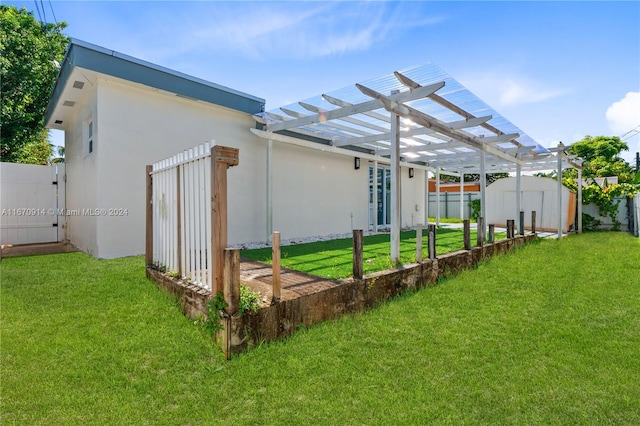 view of yard with a storage shed and a pergola