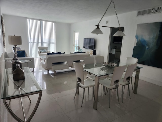 dining area with a textured ceiling