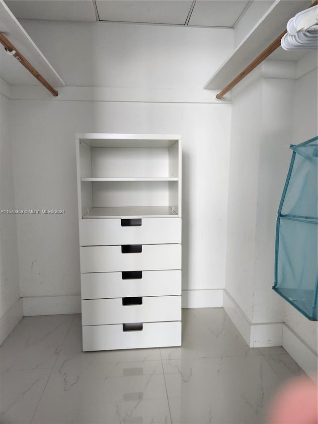 walk in closet featuring a drop ceiling