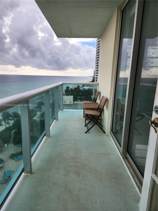 balcony featuring a water view