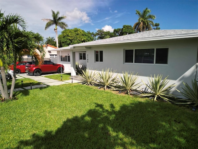 view of front of home with a front yard