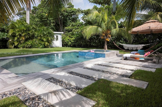 view of pool with a storage shed, a patio, and an in ground hot tub