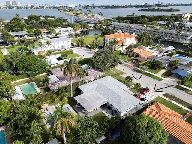 birds eye view of property featuring a water view