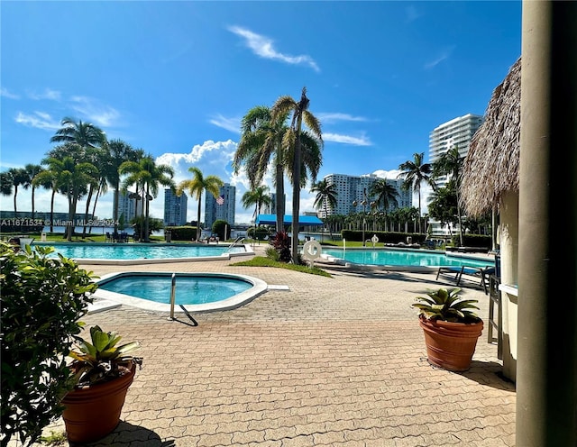 view of pool featuring a hot tub