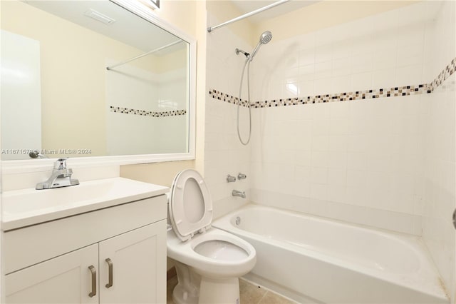 full bathroom with tile patterned flooring, vanity, toilet, and tiled shower / bath