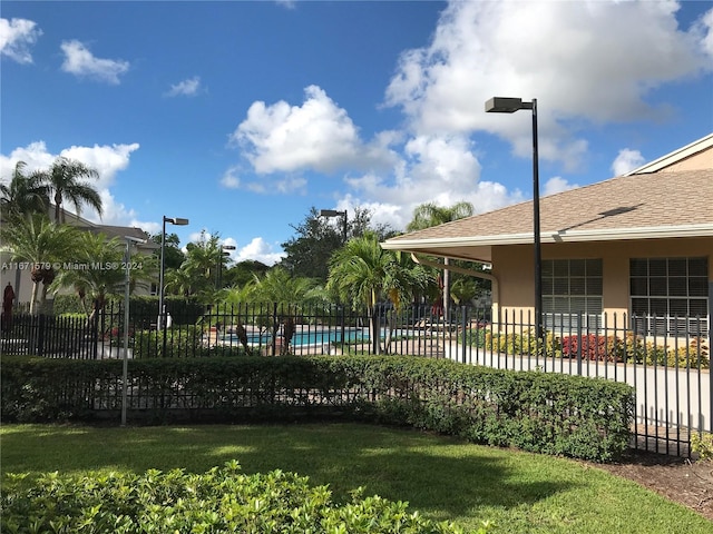 view of yard featuring a fenced in pool