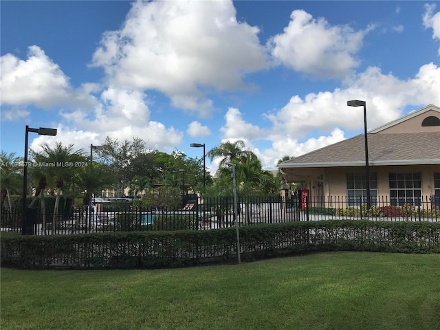 view of swimming pool featuring a lawn