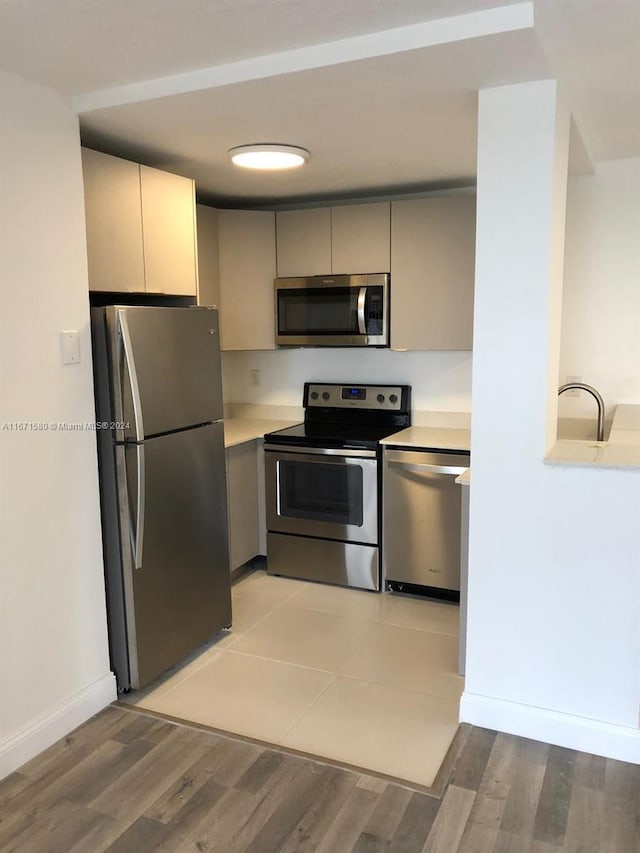 kitchen featuring stainless steel appliances and light wood-type flooring