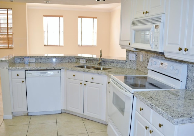 3225 NE 184th St Unit 10103, Aventura, FL 33160 - kitchen with white appliances, light tile patterned floors, white cabinets, plenty of natural light, and ornamental molding