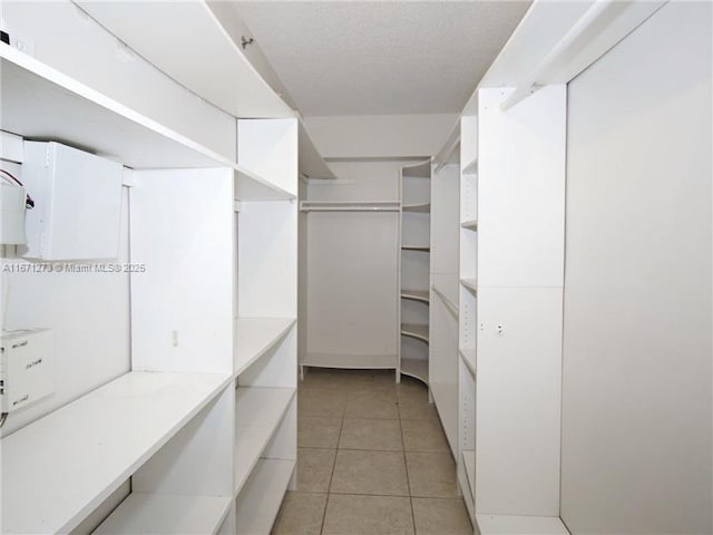 3225 NE 184th St Unit 10103, Aventura, FL 33160 - walk in closet with light tile patterned floors