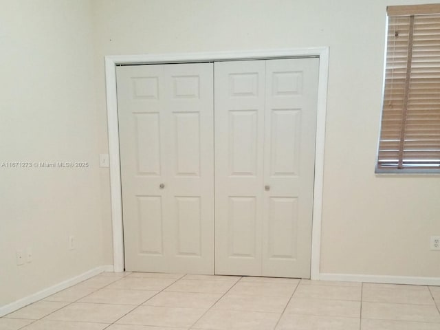 3225 NE 184th St Unit 10103, Aventura, FL 33160 - unfurnished bedroom with light tile patterned floors and a closet