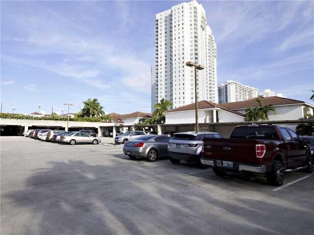 view of property with uncovered parking