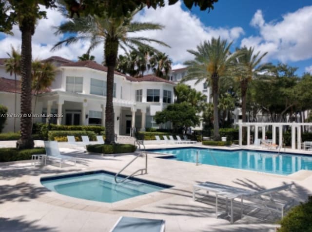 3225 NE 184th St Unit 10103, Aventura, FL 33160 - community pool with a patio area and a community hot tub