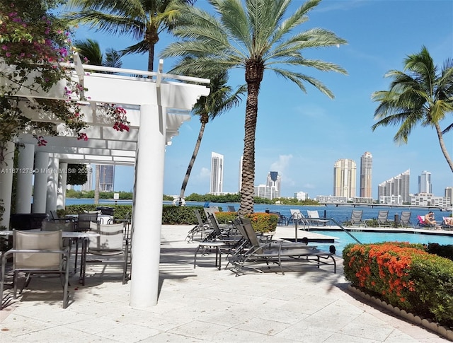 3225 NE 184th St Unit 10103, Aventura, FL 33160 - view of patio featuring a view of skyline and a community pool