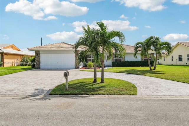 ranch-style home with a front yard and a garage