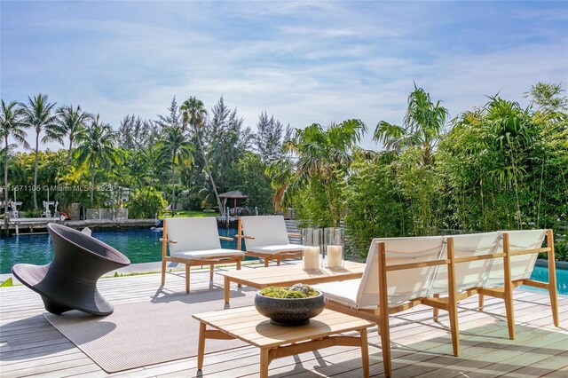 rear view of house featuring a balcony, outdoor lounge area, and a patio