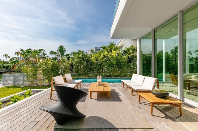 wooden deck featuring a water view