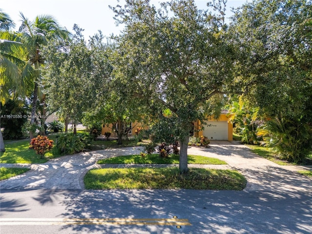 obstructed view of property featuring a garage