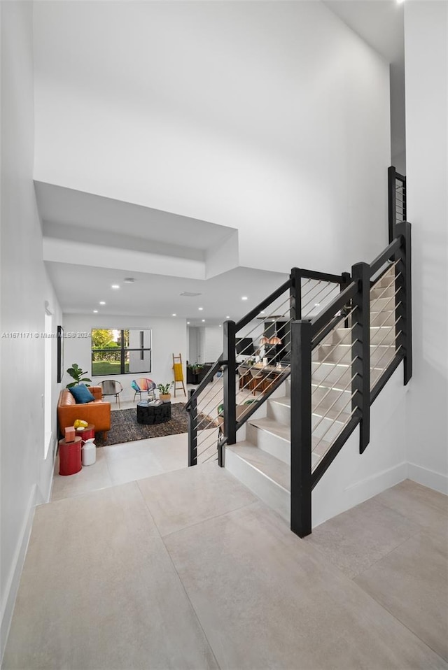 stairway featuring concrete floors