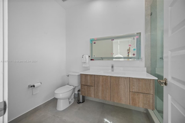 bathroom with vanity, toilet, and walk in shower