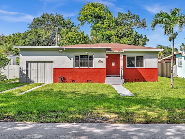 ranch-style house with a front lawn