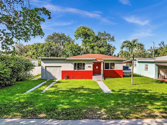 ranch-style house featuring a front lawn