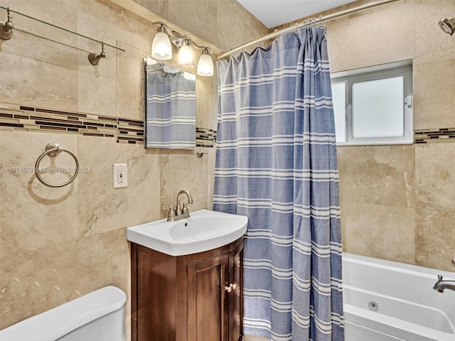 full bathroom featuring tile walls, shower / bath combo, vanity, and toilet