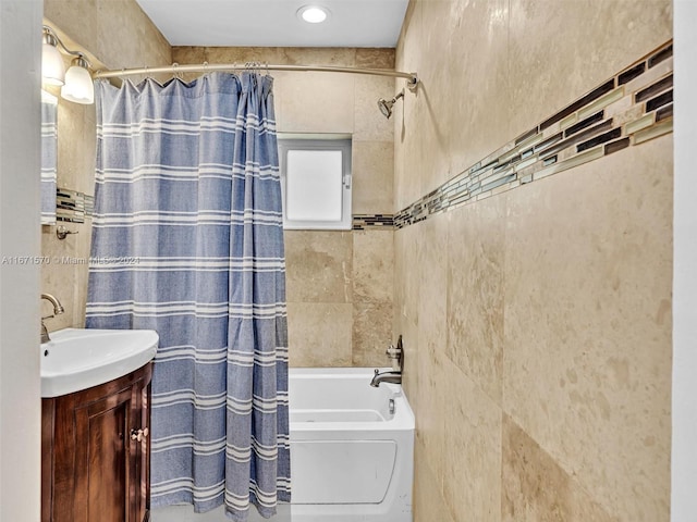 bathroom featuring vanity and shower / bath combo with shower curtain