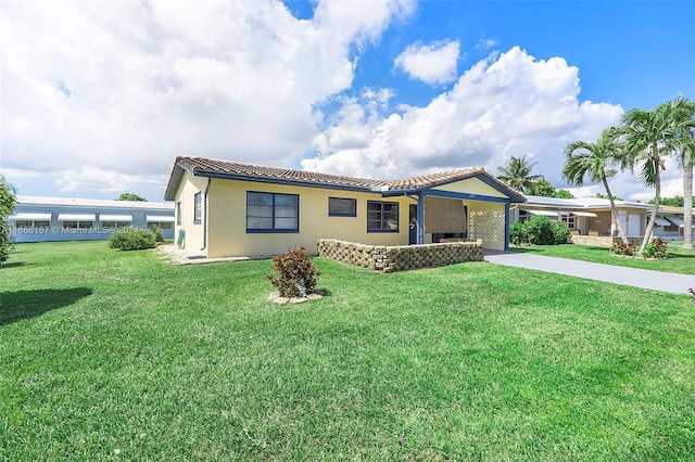 4701 Mainland Dr, Tamarac, FL 33319 - ranch-style home featuring a tiled roof, concrete driveway, a front lawn, and stucco siding