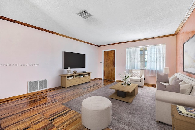 living room with a textured ceiling, carpet floors, and crown molding