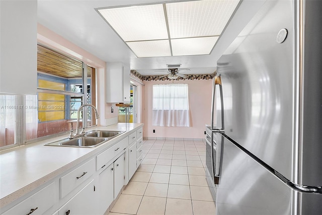 4701 Mainland Dr, Tamarac, FL 33319 - kitchen with freestanding refrigerator, a sink, light countertops, and healthy amount of natural light