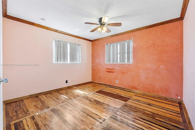 4701 Mainland Dr, Tamarac, FL 33319 - spare room featuring ceiling fan, crown molding, hardwood / wood-style floors, baseboards, and a textured ceiling