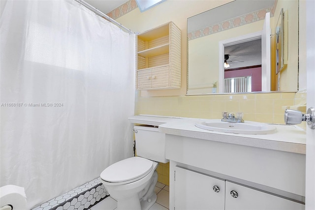 4701 Mainland Dr, Tamarac, FL 33319 - bathroom featuring tile patterned flooring, toilet, vanity, backsplash, and a ceiling fan