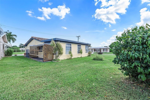 exterior space with a yard