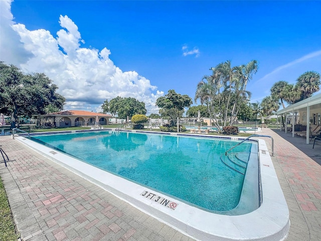 view of swimming pool with a patio area