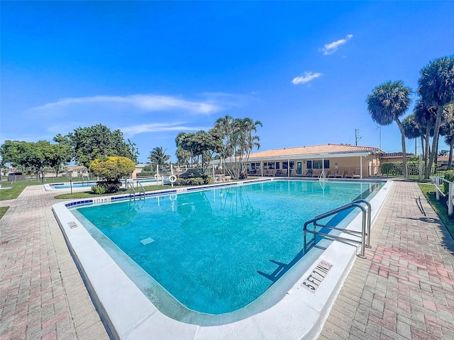 view of swimming pool with a patio area