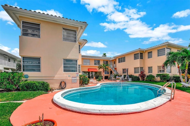 view of pool featuring a patio