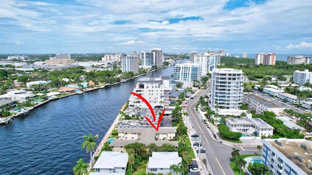 birds eye view of property with a water view