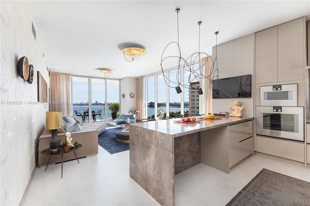 kitchen with floor to ceiling windows, kitchen peninsula, and double oven