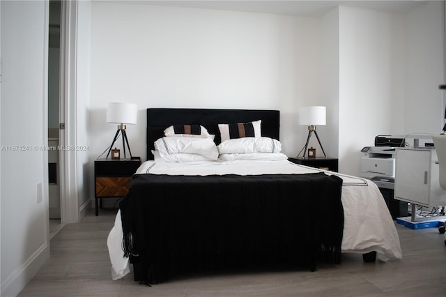 bedroom with light wood-type flooring