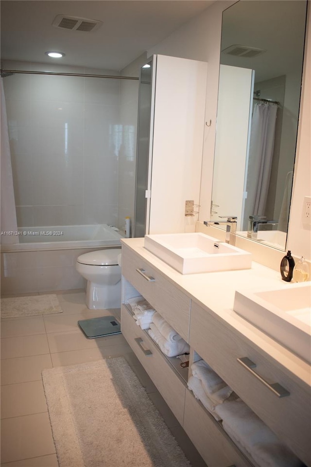 full bathroom with shower / bathtub combination with curtain, tile patterned flooring, vanity, and toilet