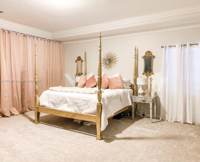 bedroom featuring crown molding and carpet flooring