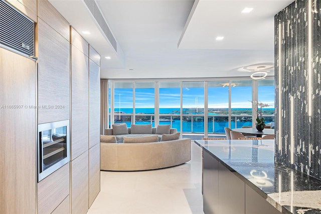 living room with a water view and a wealth of natural light