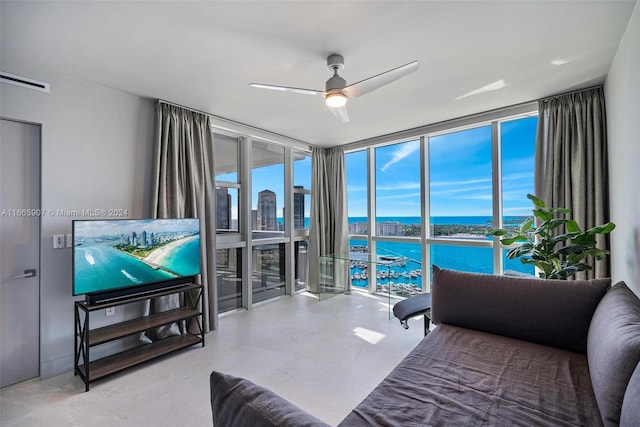 living room featuring floor to ceiling windows and ceiling fan